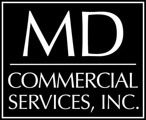 A black and white logo for md commercial services, inc. featuring bold letters "md" above the company name.